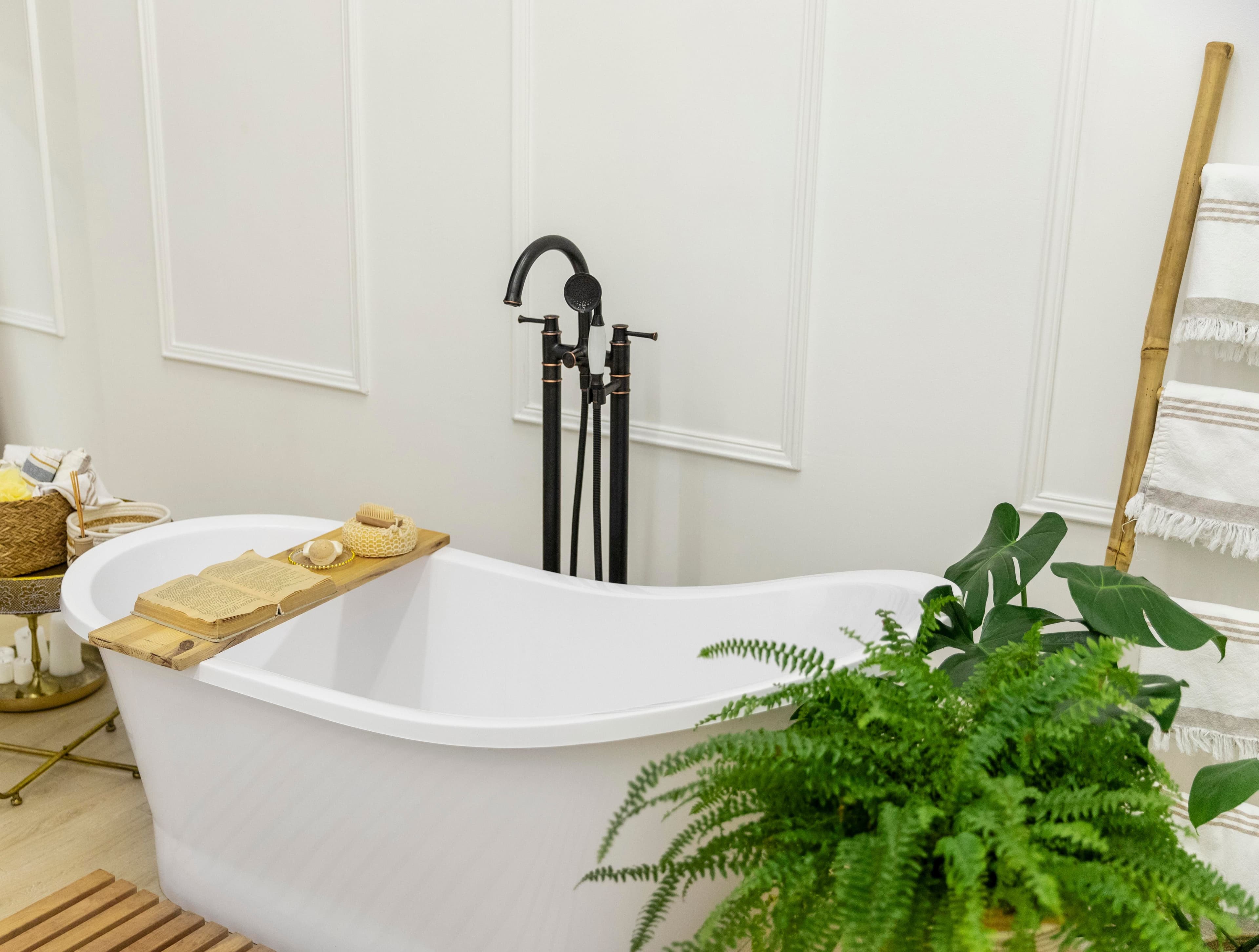 Modern luxury bathroom featuring a walk-in shower and freestanding soaking bathtub with elegant tile, natural light, and contemporary finishes.