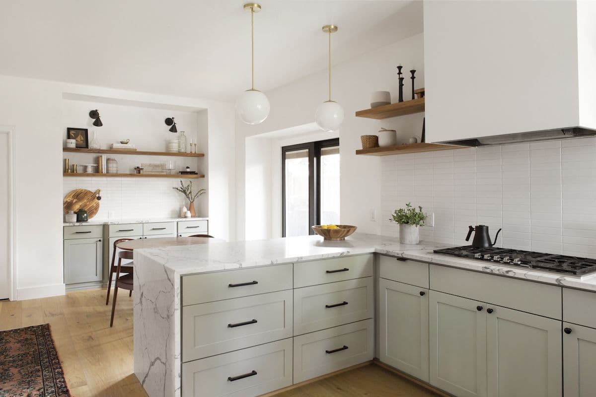 Modern kitchen remodel with functional layout, custom cabinetry, island, and thoughtful lighting design